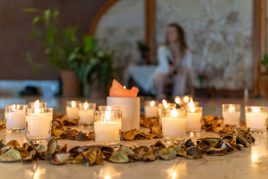 A candlelit circle in the KENAZ practice space